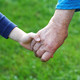 Hand of a boy in the hand of a grandmother close up 847390518 5760x3840
